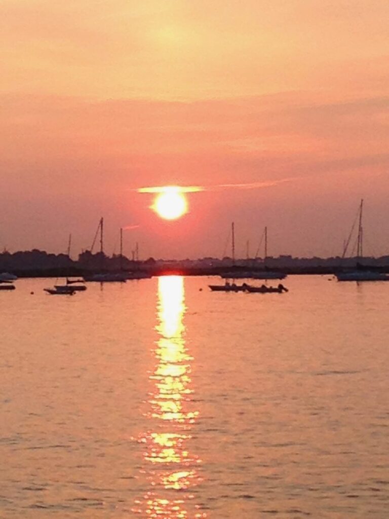 sunset and sailboats
